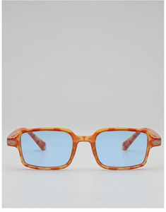 Detail view of retro rectangle sunglasses featuring amber frames and blue lenses