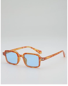 Detail of vintage square sunglasses with tortoiseshell frames and light blue ocean lenses
