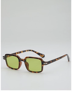 Detail of vintage square tortoiseshell sunglasses with green lenses and metal accents