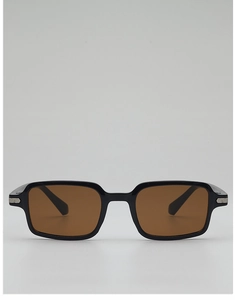 Detail of vintage black rectangular sunglasses with silver metal trim and brown lenses