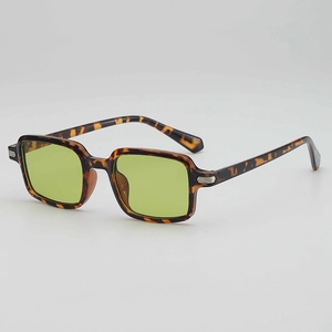 Retro tortoiseshell sunglasses with green square lenses and silver metal side accents