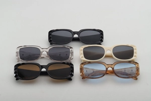 Detailed view of square sunglasses featuring a 3D diamond texture and multiple colors