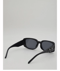 Detailed close-up of stylish square frame sunglasses with geometric textured temples