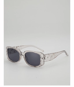 Detail of square jelly grey sunglasses frame with unique geometric diamond-cut textures