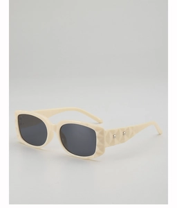 Detail of cream square sunglasses with geometric diamond-cut texture and silver rivets