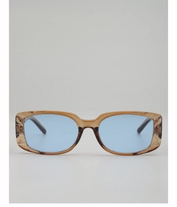 Detail of square amber sunglasses featuring textured diamond patterns and blue lenses