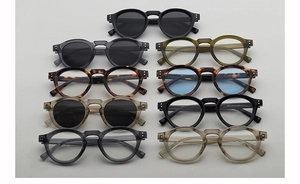 Macro display of nine round vintage eyewear styles featuring bold frames and keyhole bridges