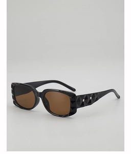 Detail of square sunglasses with black frame featuring 3D geometric diamond texture