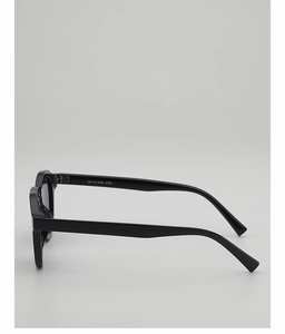 Side view of black round frame sunglasses showing temple thickness and curved arm design