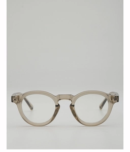Detailed close-up of retro round brown transparent eyeglass frames with clear lenses