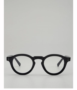 Close-up of black round eyeglass frames with silver double rivet details and polished finish