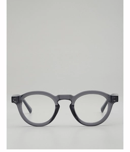 Macro detail of transparent grey round frame glasses featuring metallic hinge rivets