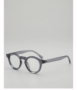 Detail of grey translucent round frame glasses with silver rivets and inner temple specs