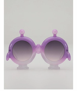 Detail view of purple alien monster shaped sunglasses for kids with round grey lenses