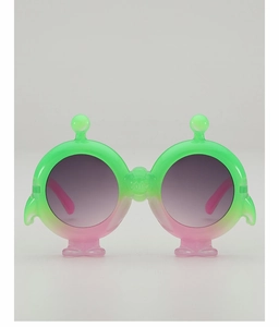 Close-up of alien-style kids sunglasses with neon green frame and pink gradient accents