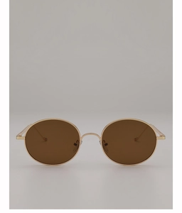 Détails de lunettes de soleil rondes en métal avec monture dorée et verres marron foncé