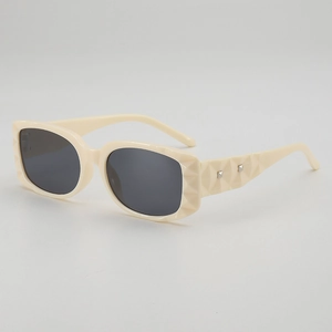 Retro cream square sunglasses with geometric textured frames and dark lenses