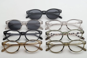 Group display of stylish sunglasses and clear frame glasses in various trendy colors