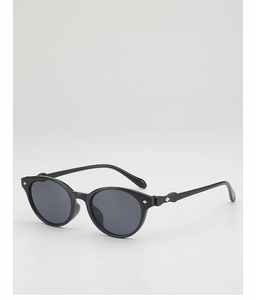 Detail of black round frame sunglasses with silver diamond rivets and dark grey lenses