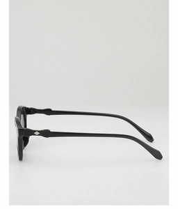 Detail of black sunglasses frame with silver diamond metal decor on the temples