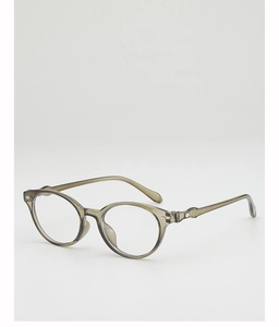 Detail view of transparent olive green glasses frame with diamond metal accents