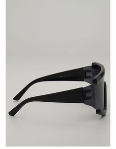 Detail view of large cycling sunglasses with printed specifications on the wide temple arm