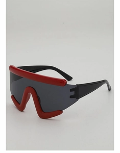 Detail of futuristic oversized cycling sunglasses with red wave frame and dark grey lenses