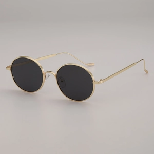Lunettes de soleil ovales en métal avec verres ronds noirs et monture dorée