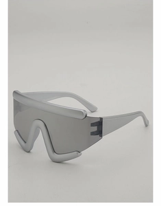 Macro detail of futuristic silver oversized shield sunglasses with a bold W-shaped frame