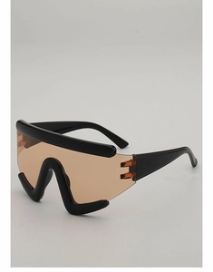Detail showing brown futuristic shield lenses and black wrap-around frame of outdoor eyewear