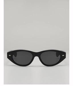 Close-up of black retro oval sunglasses with polished frame and silver diamond rivets