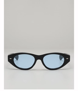 Detail view of cat eye sunglasses with leopard print frame and blue ocean lenses