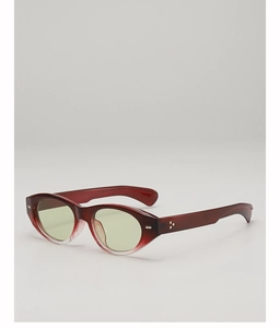 Detail of burgundy gradient cat eye sunglasses with silver star rivets and light green lenses