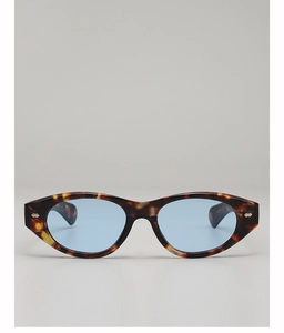 Detail of vintage cat-eye sunglasses with tortoise frame and light blue ocean lenses