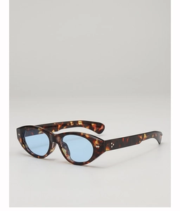 Detailed view of leopard print cat-eye sunglasses with light blue ocean lenses