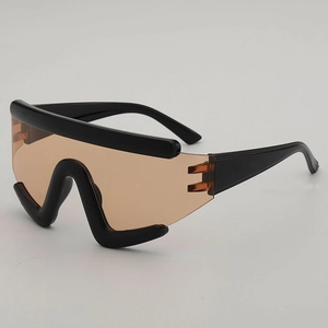 Futuristic large frame oversized cycling sunglasses with bold black frame and amber lenses