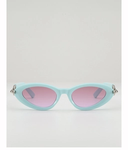 Close-up of mint blue cat-eye frame with pink lenses and silver hinge details