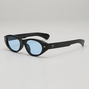 Retro thick black frame cat eye sunglasses with blue ocean lenses and metal accents