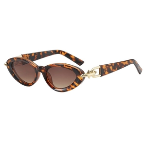 Retro cat-eye tortoiseshell sunglasses with brown gradient lenses and gold chain link
