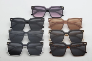 Collection of oversized square sunglasses in various colors with stylish gold accents