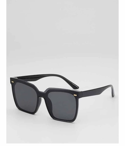 Detail shot of black square sunglasses with decorative gold metal accents on frame