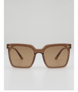 Detail view of square tortoiseshell sunglasses with brown lenses and golden accents