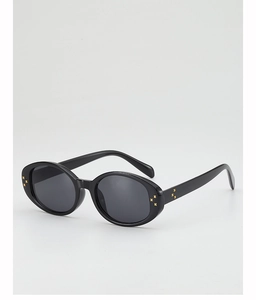 Detail view of retro oval sunglasses with black frames and gold floral rivet accents
