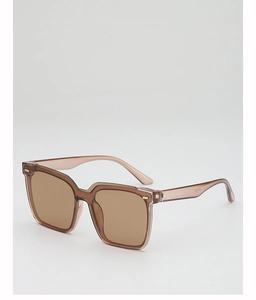 Detail view of transparent tea-colored square frame sunglasses with metal rivets