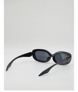 Detail view of oval black sunglasses WF1297 with polished resin frames and dark gray lenses