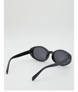 Detail view of oval sunglasses with gold triple rivets on the temple and model WF1282