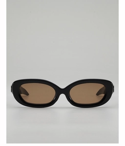 Front view of oval sunglasses with glossy black frame and translucent brown lenses