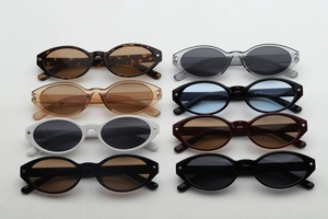 Detail view of oval leopard print sunglasses set with chic star rivets and multiple colors