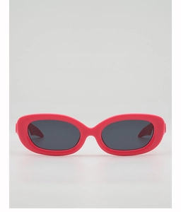 Close-up of bright rose pink oval sunglasses with dark lenses for trendy millenial fashion