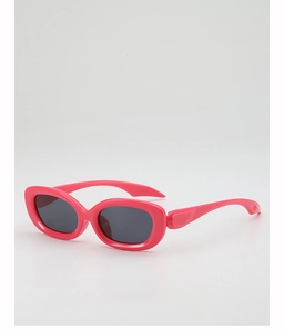 Detail of bright pink oval sunglasses with dark grey lenses in retro dopamine style